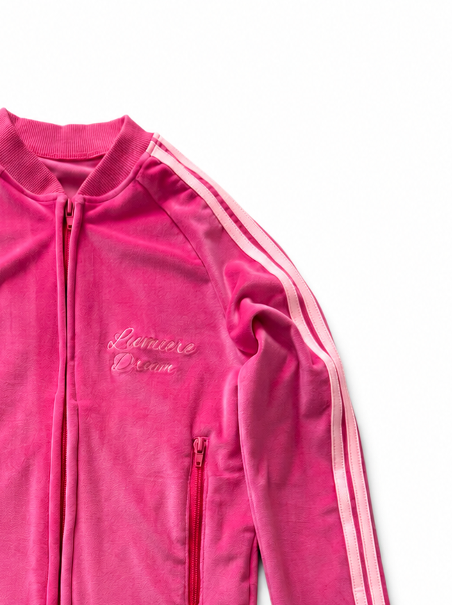 Pink track jacket with three stripes on a white background